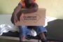 young-boy-with-box-and-shoes